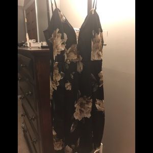 Black spaghetti strap dress with floral accents